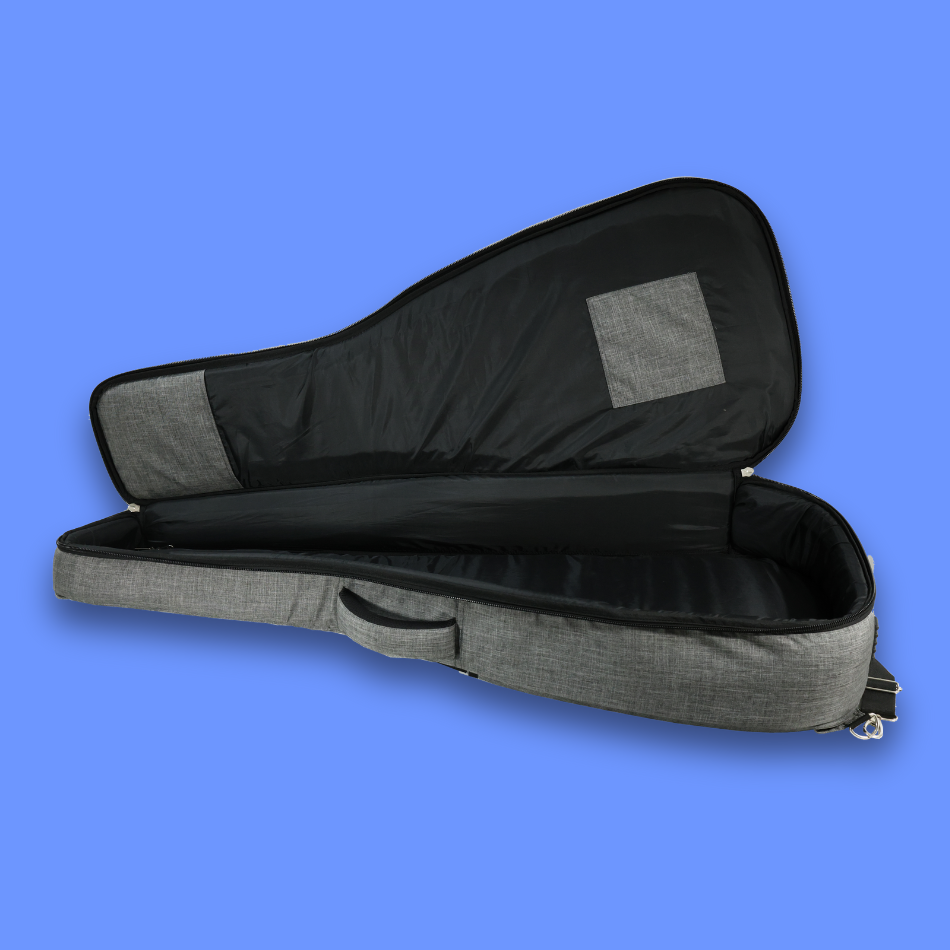 An open view of an empty acoustic guitar bag lying on the floor.